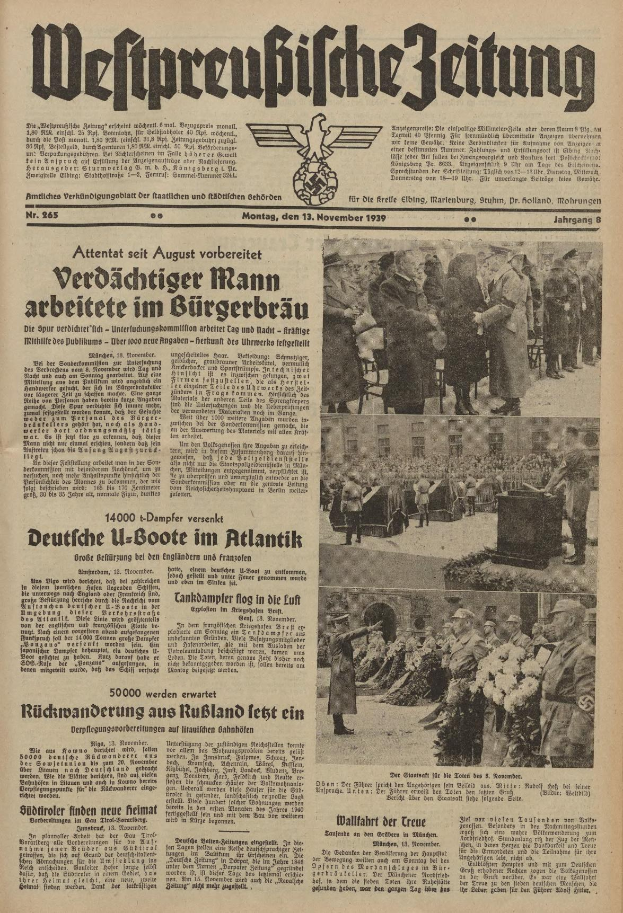 Schwarze und weiße Titelseite einer deutschen Zeitung vom 13. November 1939 mit der Schlagzeile "Weitpreubliche Zeitung", die eine Gruppe von Menschen in traditioneller deutscher Kleidung in einer feierlichen Umgebung zeigt.