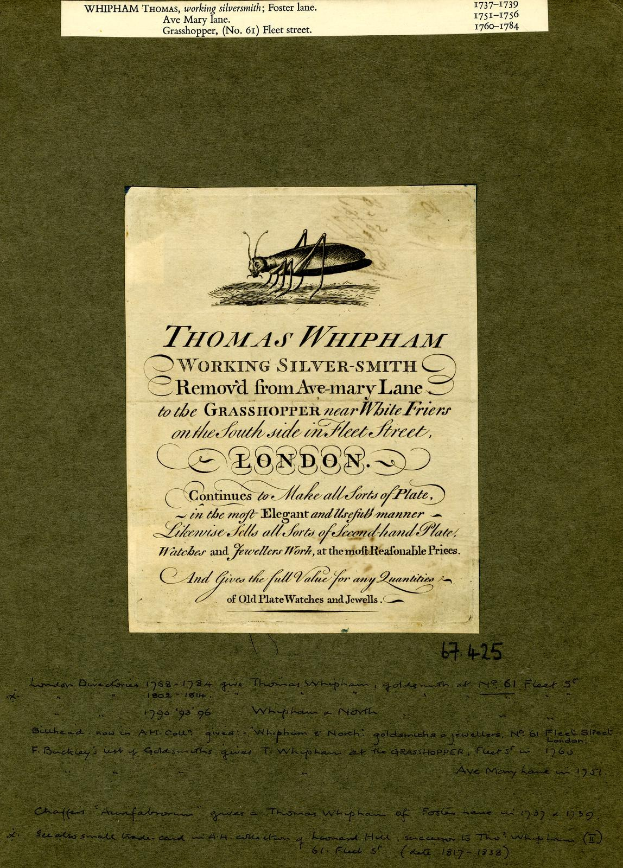 Ein altes Buch mit einer Zeichnung einer Heuschrecke auf dem Cover, das Text auf den Seiten enthält.